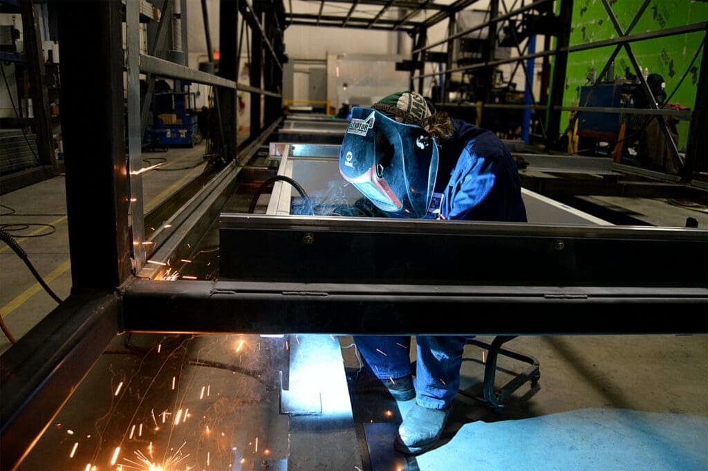 person welding metal