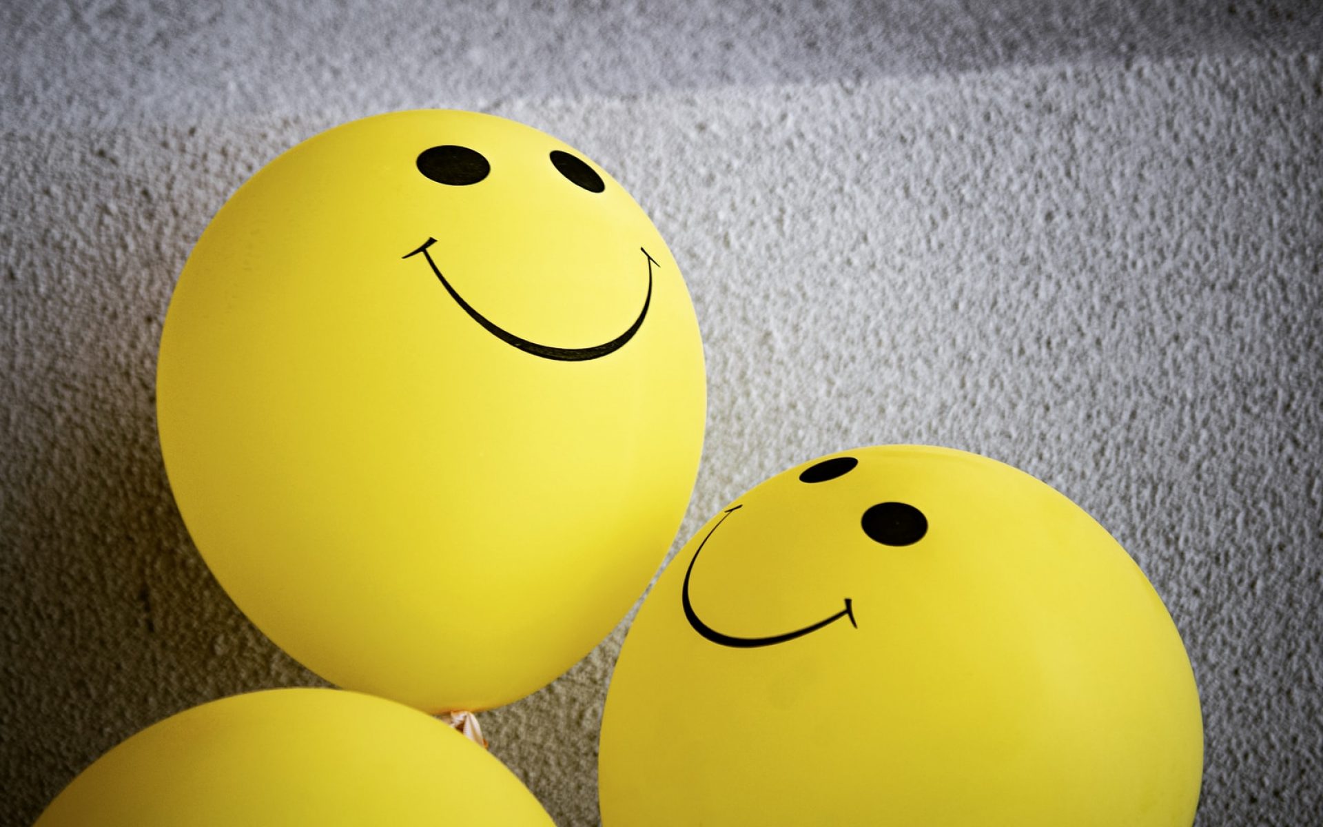 yellow smiley emoji on gray textile