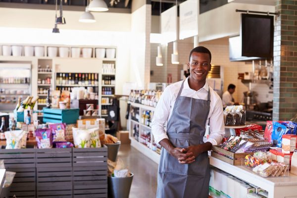 portrait-of-male-employee-working-in-delicatessen-PAW8NR3