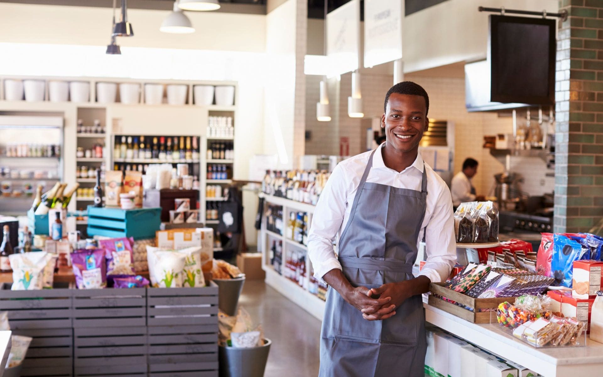 portrait-of-male-employee-working-in-delicatessen-PAW8NR3